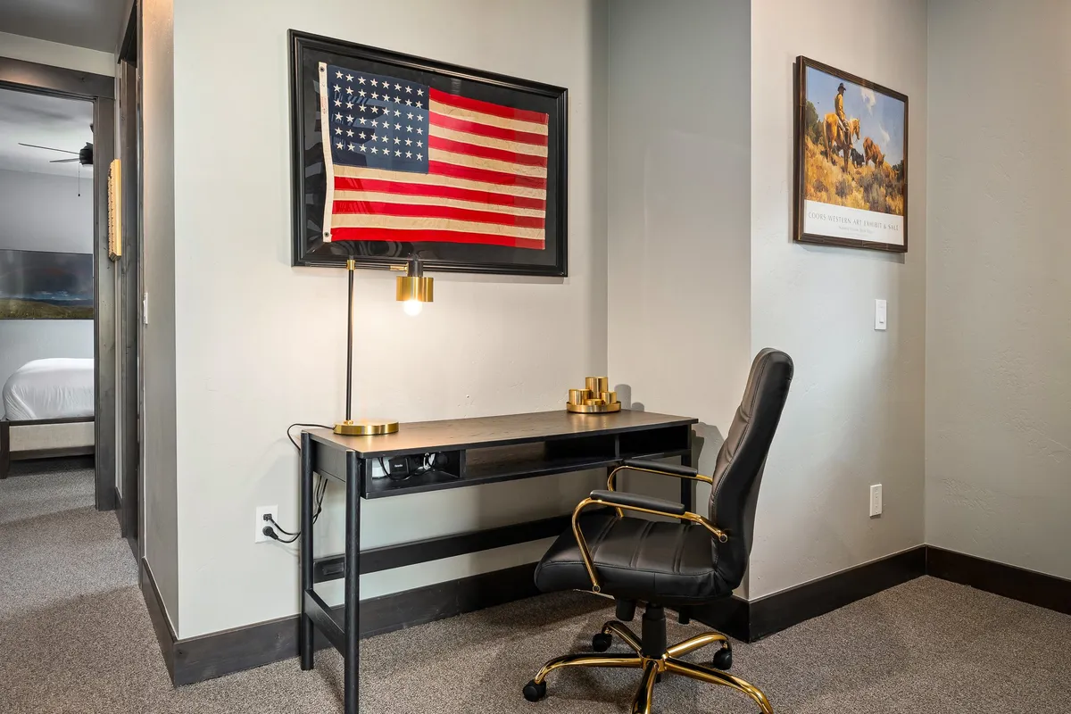 A modern, productive remote work area featuring a sleek desk, comfortable chair, and decor that inspires creativity and focus.